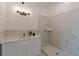 Bathroom with modern lighting, shiplap walls, a stone countertop, and a glass-enclosed shower at 379 Bohannon Rd, Grantville, GA 30220