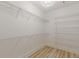 Spacious walk-in closet with wall-mounted wire shelving and wood-look floors at 379 Bohannon Rd, Grantville, GA 30220