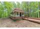 Quaint cottage-style home with inviting front porch and lush natural surroundings at 379 Bohannon Rd, Grantville, GA 30220