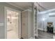 Hallway featuring unique ladder, modern lighting, and access to the bathroom at 379 Bohannon Rd, Grantville, GA 30220