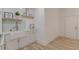 Stylish kitchen features a farmhouse sink, white cabinets, and modern decor accents at 379 Bohannon Rd, Grantville, GA 30220