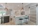 Modern kitchen with island seating, stainless steel appliances, and sliding barn door at 379 Bohannon Rd, Grantville, GA 30220
