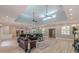Open-concept living area with high ceilings, ceiling fans, and natural light at 379 Bohannon Rd, Grantville, GA 30220