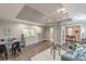 Open-concept living area with modern finishes, vaulted ceiling, and a unique ladder to loft space at 379 Bohannon Rd, Grantville, GA 30220