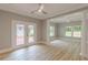 Bright living room featuring wood-look floors and french doors to an outdoor living space at 379 Bohannon Rd, Grantville, GA 30220