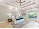 Spacious main bedroom features a tray ceiling, neutral colors, and an attached sitting area at 379 Bohannon Rd, Grantville, GA 30220