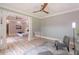 Inviting sitting room with wood flooring, neutral paint, decorative columns, and plenty of natural light at 379 Bohannon Rd, Grantville, GA 30220