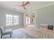 Bright and airy sitting room with hardwood floors, large windows, neutral color palette, and comfortable seating at 379 Bohannon Rd, Grantville, GA 30220