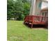 Backyard featuring a wooden deck with steps down to the backyard at 5517 Rock Shoals Way, Atlanta, GA 30349