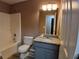 Bathroom featuring granite countertop vanity, new fixtures, and tiled shower at 5517 Rock Shoals Way, Atlanta, GA 30349