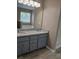 This bathroom has granite countertops, double sinks and lots of light at 5517 Rock Shoals Way, Atlanta, GA 30349