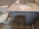 Charming bathroom featuring granite countertops, new fixtures, and updated cabinets at 5517 Rock Shoals Way, Atlanta, GA 30349