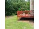 Back deck overlooking the yard with new stain, perfect for outdoor relaxation and entertaining at 5517 Rock Shoals Way, Atlanta, GA 30349