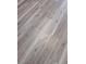 Close up of gray woodgrain vinyl flooring at 5517 Rock Shoals Way, Atlanta, GA 30349