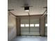 An interior shot of the garage with two white garage doors and garage door openers at 5517 Rock Shoals Way, Atlanta, GA 30349
