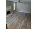 The living room has a decorative fireplace and plenty of natural light at 5517 Rock Shoals Way, Atlanta, GA 30349