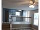 Living room view that opens to a kitchen, separated by a white railing at 5517 Rock Shoals Way, Atlanta, GA 30349