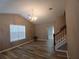 This living room has hard floors, and a large window at 5517 Rock Shoals Way, Atlanta, GA 30349