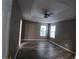 Spacious primary bedroom with a trey ceiling, wood-look floors, and ample natural light at 5517 Rock Shoals Way, Atlanta, GA 30349