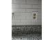 Wall with subway tile backsplash and electrical outlet at 5517 Rock Shoals Way, Atlanta, GA 30349