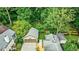 Aerial view showcasing a private backyard, lush greenery, and detached garage, creating a serene outdoor space at 1146 Cumberland Ne Rd, Atlanta, GA 30306