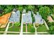 Aerial view showing the well-manicured lawns and architectural design of neighboring homes in a tree-lined street at 1146 Cumberland Ne Rd, Atlanta, GA 30306
