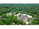 Aerial shot of school campus surrounded by lush trees, highlighting its expansive grounds and athletic field at 1146 Cumberland Ne Rd, Atlanta, GA 30306