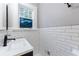 Modern bathroom with subway tile and dark fixtures at 1146 Cumberland Ne Rd, Atlanta, GA 30306