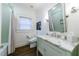 Charming bathroom with a marble countertop, and elegant fixtures complementing the mint green accents at 1146 Cumberland Ne Rd, Atlanta, GA 30306