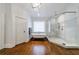 Elegant bathroom with clawfoot tub, glass shower, hardwood floors, and modern fixtures at 1146 Cumberland Ne Rd, Atlanta, GA 30306