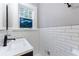 Modern bathroom with subway tile, black fixtures, and decorative mirror at 1146 Cumberland Ne Rd, Atlanta, GA 30306
