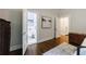 Bedroom with ensuite bathroom, hardwood floors, and neutral decor at 1146 Cumberland Ne Rd, Atlanta, GA 30306