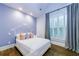 Inviting bedroom with soft blue walls, wood floors and plush bedding at 1146 Cumberland Ne Rd, Atlanta, GA 30306