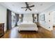 Spacious bedroom with a ceiling fan, hardwood floors, and ample natural light from surrounding windows at 1146 Cumberland Ne Rd, Atlanta, GA 30306