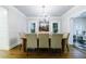 Bright dining room with modern lighting, large windows, and an open floor plan at 1146 Cumberland Ne Rd, Atlanta, GA 30306