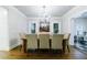 Bright dining room featuring hardwood floors, chandelier, and view to outside at 1146 Cumberland Ne Rd, Atlanta, GA 30306