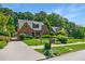 Beautiful brick home with lush landscaping, a long driveway, and a detached garage at 1146 Cumberland Ne Rd, Atlanta, GA 30306