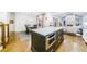 Spacious kitchen with a dark island, stainless steel microwave, and open concept design at 1146 Cumberland Ne Rd, Atlanta, GA 30306