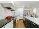 A modern kitchen featuring a large island, tiled backsplash, and stainless steel appliances at 1146 Cumberland Ne Rd, Atlanta, GA 30306