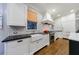 Modern kitchen with a farmhouse sink, subway tile backsplash, and stainless steel appliances at 1146 Cumberland Ne Rd, Atlanta, GA 30306