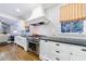 Bright kitchen with stainless steel appliances, subway tile, and white cabinetry at 1146 Cumberland Ne Rd, Atlanta, GA 30306