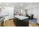 A bright kitchen with an island and stainless appliances is adjacent to a formal dining area at 1146 Cumberland Ne Rd, Atlanta, GA 30306