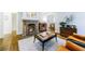 Cozy living room with a brick fireplace, hardwood floors, and elegant furnishings at 1146 Cumberland Ne Rd, Atlanta, GA 30306