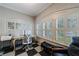 Bright office space featuring charming architectural details, a checkerboard floor, and large windows at 1146 Cumberland Ne Rd, Atlanta, GA 30306