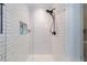 Updated shower features white subway tile, a built-in niche, and stylish fixtures at 1146 Cumberland Ne Rd, Atlanta, GA 30306