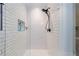 Modern bathroom shower featuring white subway tile and a sleek, matte black shower head at 1146 Cumberland Ne Rd, Atlanta, GA 30306