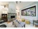 The sun room includes a stone fireplace and views of the backyard at 1146 Cumberland Ne Rd, Atlanta, GA 30306
