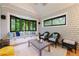The sun room includes bench seating and outdoor views at 1146 Cumberland Ne Rd, Atlanta, GA 30306
