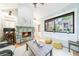 Cozy sunroom with stone fireplace, tile floors, and natural light at 1146 Cumberland Ne Rd, Atlanta, GA 30306