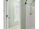 Bathroom featuring a shower stall and an adjacent window at 212 Ranier Court, Canton, GA 30114